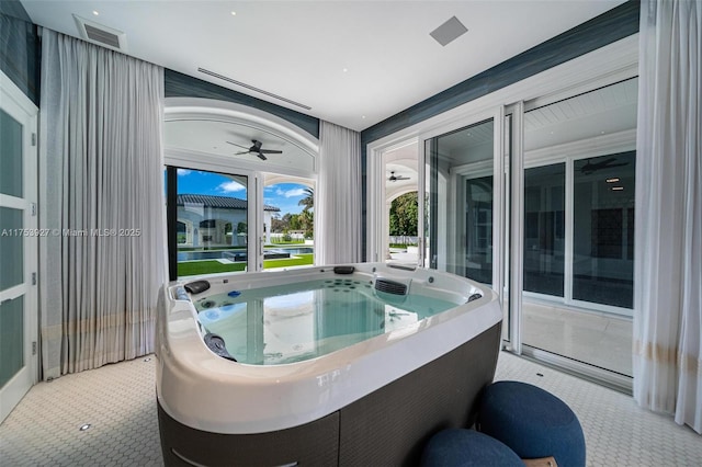 view of patio featuring visible vents and a hot tub