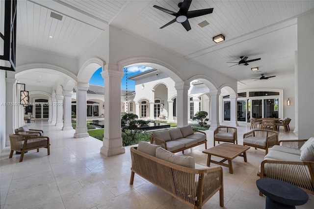 view of patio with ceiling fan and outdoor lounge area