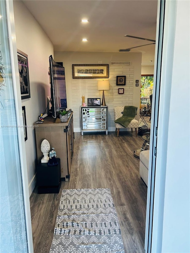 interior space with recessed lighting, baseboards, and dark wood finished floors