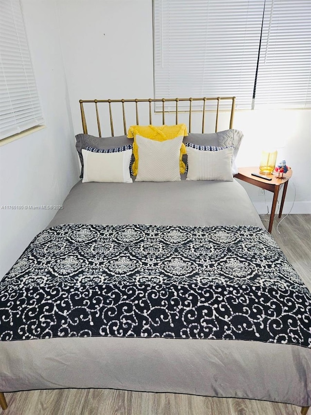 bedroom with wood finished floors