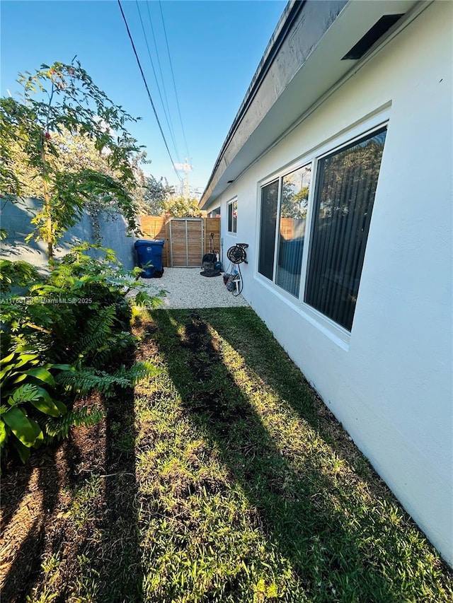 view of yard featuring a patio and fence