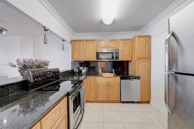 kitchen with backsplash, stainless steel appliances, dark stone counters, light tile patterned flooring, and crown molding