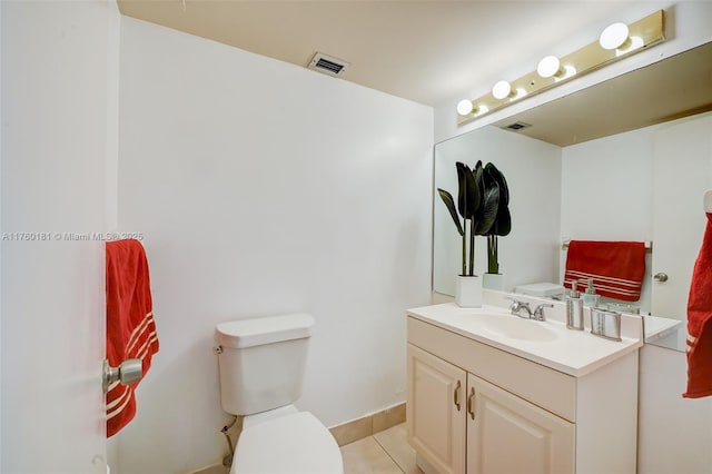 bathroom featuring visible vents, toilet, tile patterned flooring, baseboards, and vanity