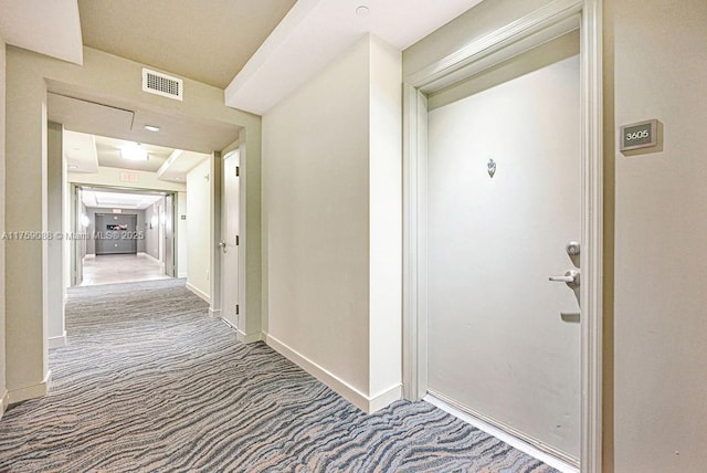 950 Brickell Bay Dr Unit 3605, Miami, FL 33131 - hall featuring visible vents, baseboards, and carpet flooring