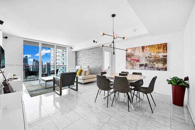 950 Brickell Bay Dr Unit 3605, Miami, FL 33131 - dining space featuring a wall of windows, marble finish floor, a city view, and a chandelier