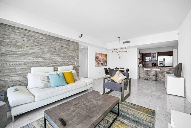 950 Brickell Bay Dr Unit 3605, Miami, FL 33131 - living room featuring visible vents, a notable chandelier, and marble finish floor