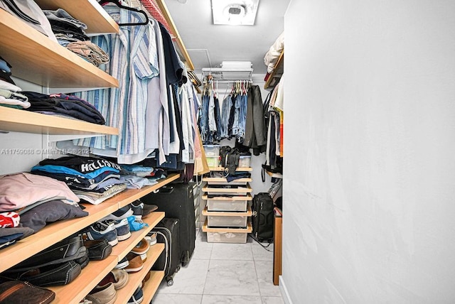 950 Brickell Bay Dr Unit 3605, Miami, FL 33131 - walk in closet featuring marble finish floor