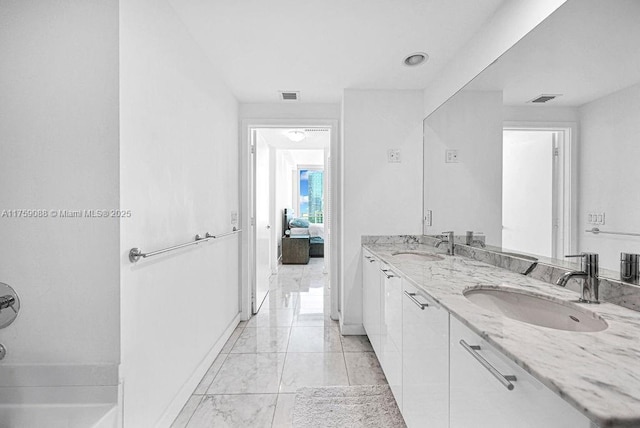 950 Brickell Bay Dr Unit 3605, Miami, FL 33131 - full bathroom featuring visible vents, marble finish floor, and a sink