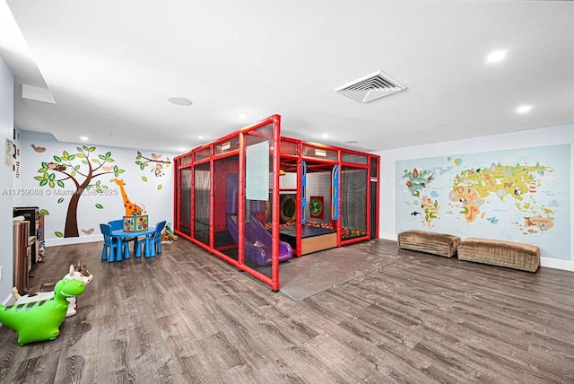 950 Brickell Bay Dr Unit 3605, Miami, FL 33131 - recreation room with visible vents, recessed lighting, baseboards, and wood finished floors
