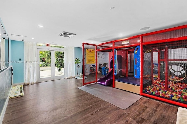 950 Brickell Bay Dr Unit 3605, Miami, FL 33131 - rec room featuring visible vents, french doors, and wood finished floors
