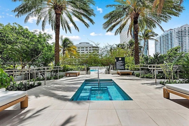 950 Brickell Bay Dr Unit 3605, Miami, FL 33131 - community pool featuring a patio and a city view