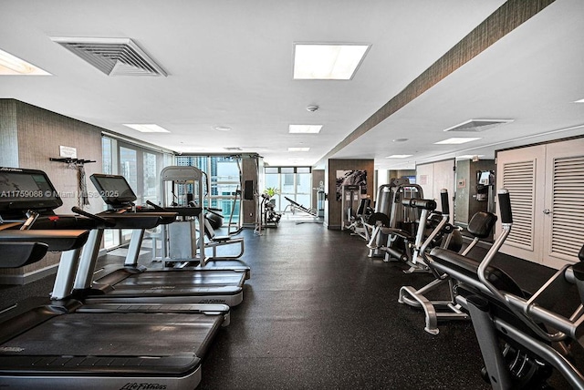 950 Brickell Bay Dr Unit 3605, Miami, FL 33131 - exercise room featuring visible vents and a wall of windows