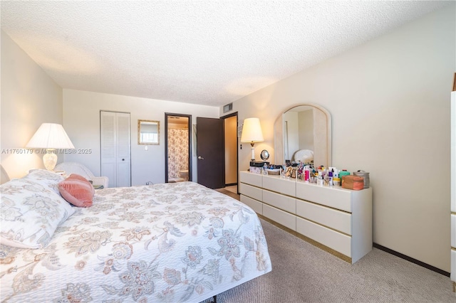 carpeted bedroom featuring visible vents and a textured ceiling