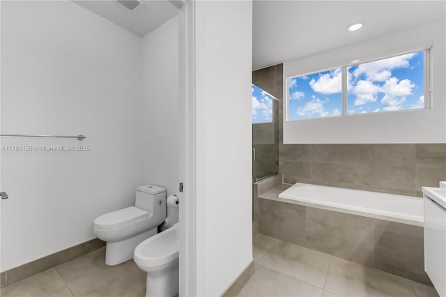 full bathroom featuring a bath, a bidet, a tile shower, tile patterned flooring, and toilet