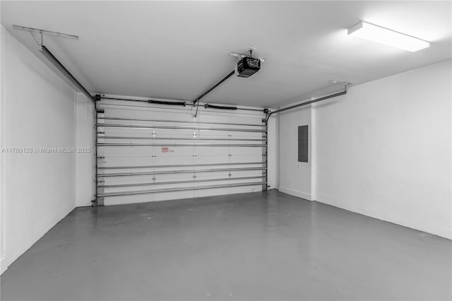 garage featuring electric panel and a garage door opener