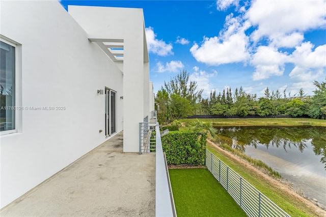 balcony featuring a water view