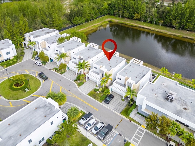 aerial view featuring a residential view and a water view