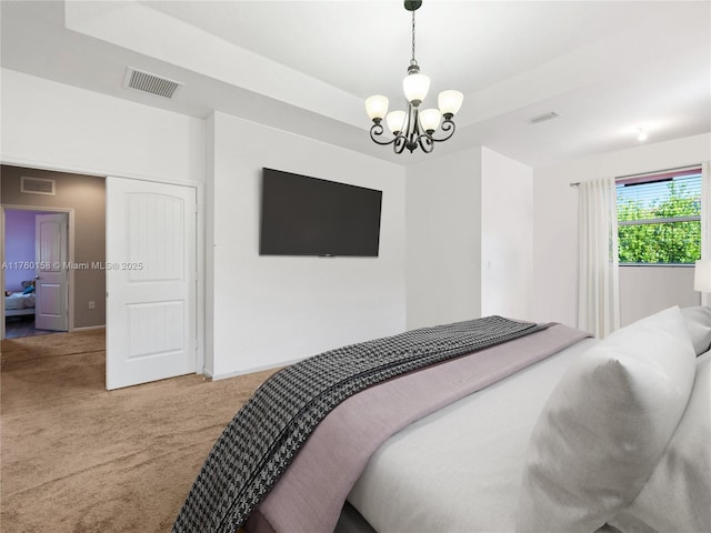 bedroom featuring a chandelier, visible vents, light carpet, and a raised ceiling