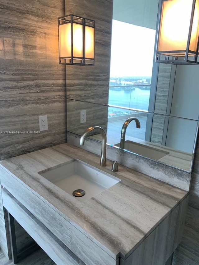 bathroom featuring vanity and a water view