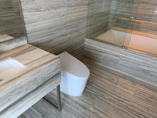 full bathroom featuring an enclosed shower and vanity