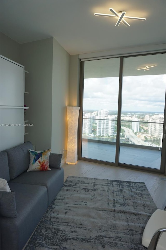 living area featuring a wall of windows