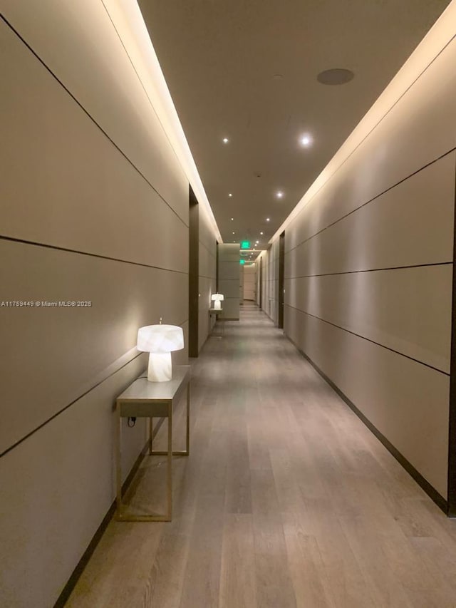 corridor featuring recessed lighting and light wood-style flooring