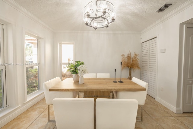 dining space featuring crown molding, light tile patterned flooring, visible vents, and a chandelier