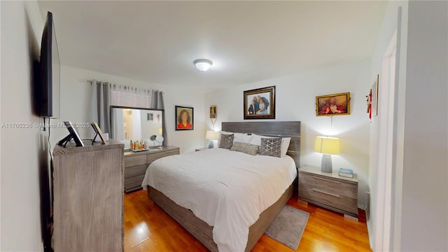 bedroom with light wood-type flooring