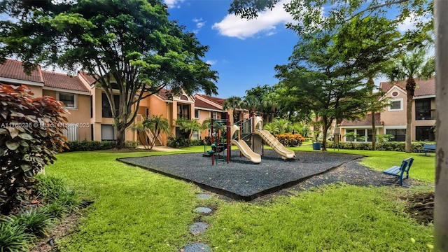 community play area with a residential view and a yard