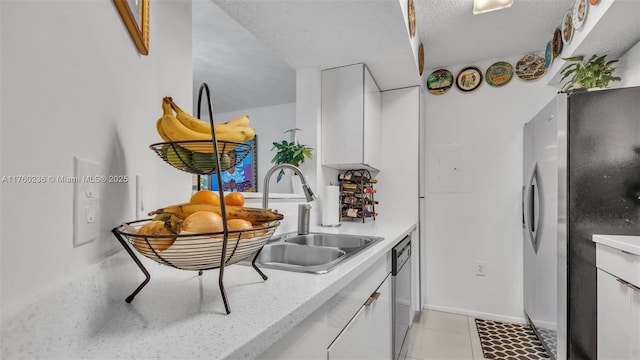 15591 SW 105th Ter Unit 524, Miami, FL 33196 - kitchen with stainless steel appliances, white cabinetry, modern cabinets, and a textured ceiling