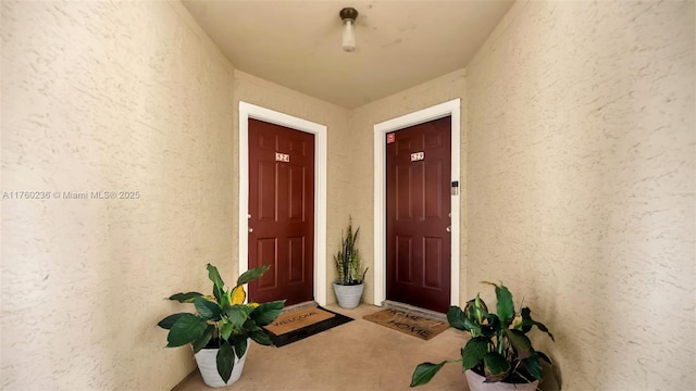 property entrance with stucco siding