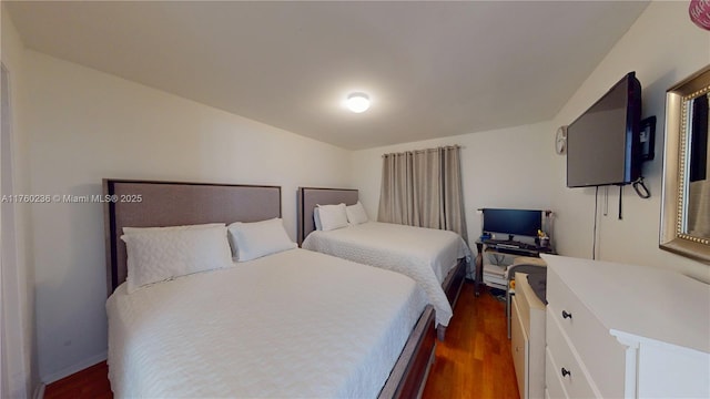 bedroom featuring dark wood-style floors