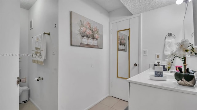 15591 SW 105th Ter Unit 524, Miami, FL 33196 - bathroom with a textured ceiling, vanity, and tile patterned floors