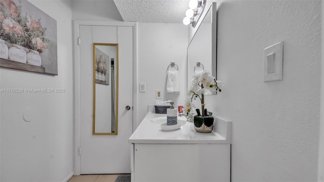 15591 SW 105th Ter Unit 524, Miami, FL 33196 - bathroom featuring a textured ceiling, vanity, and tile patterned floors
