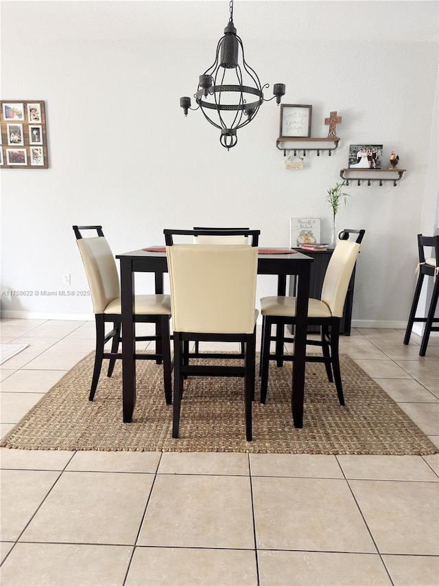 2620 Pierce St Unit A2, Hollywood, FL 33020 - dining space with tile patterned floors, a chandelier, and baseboards