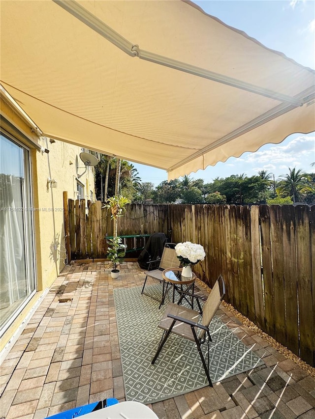 view of patio / terrace with fence