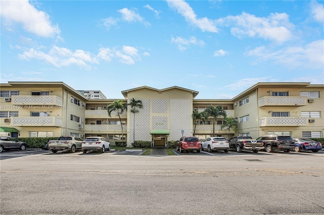 view of property with uncovered parking