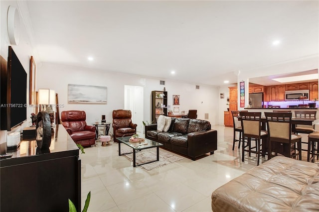 living room with recessed lighting, visible vents, light tile patterned flooring, and ornamental molding