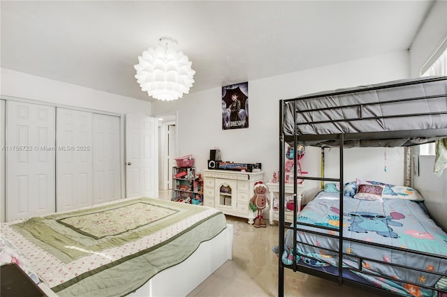 bedroom featuring a closet and a notable chandelier