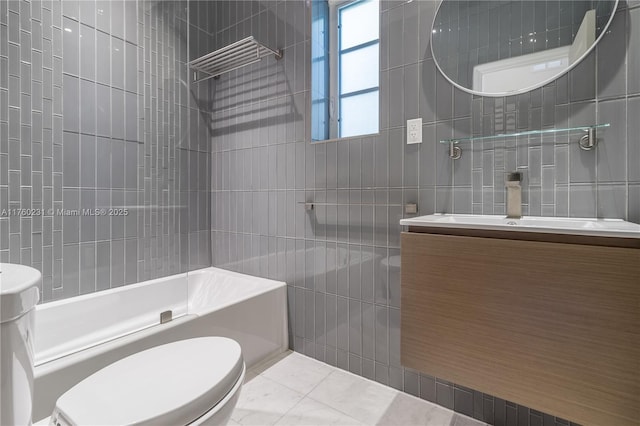 full bathroom featuring vanity, tile patterned flooring, tile walls, toilet, and shower / bathtub combination