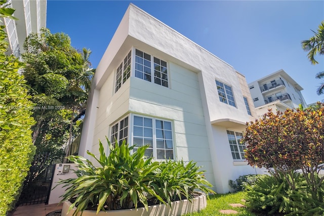 view of property exterior with stucco siding