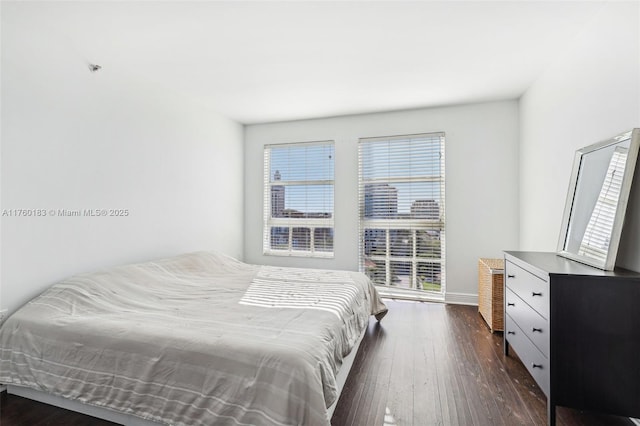 bedroom featuring dark wood finished floors