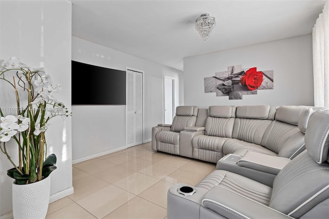 living room with light tile patterned floors and baseboards