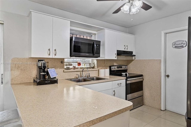 kitchen featuring stainless steel range with electric stovetop, a sink, under cabinet range hood, white cabinetry, and light countertops