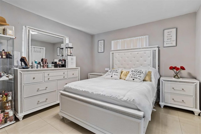 bedroom featuring light tile patterned flooring