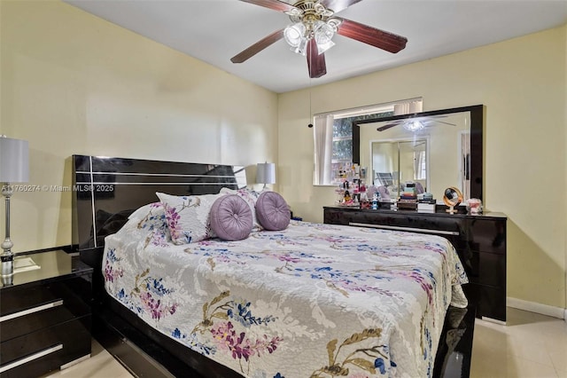 bedroom featuring baseboards and a ceiling fan