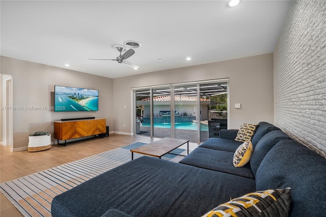 living room with wood finished floors, visible vents, baseboards, recessed lighting, and ceiling fan