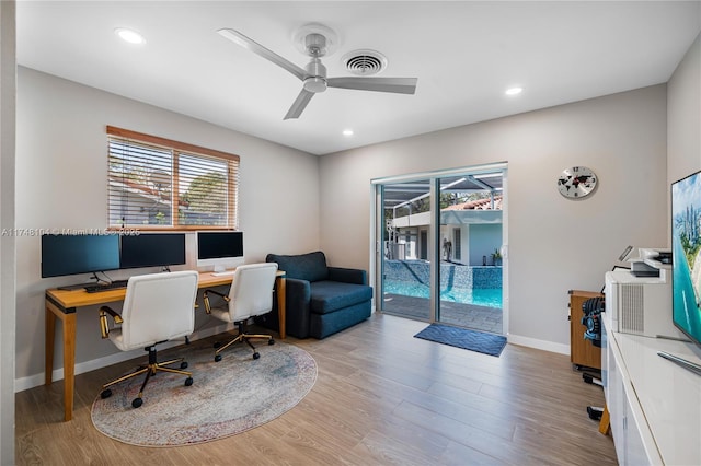 office with ceiling fan, recessed lighting, baseboards, wood finished floors, and visible vents