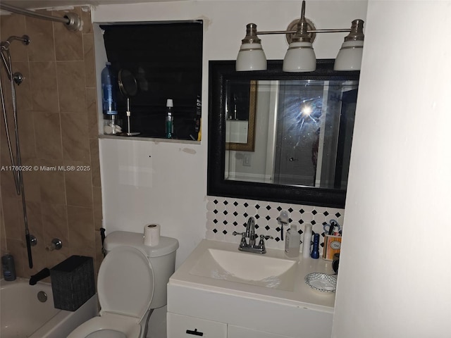 bathroom with vanity, toilet, and shower / bath combination