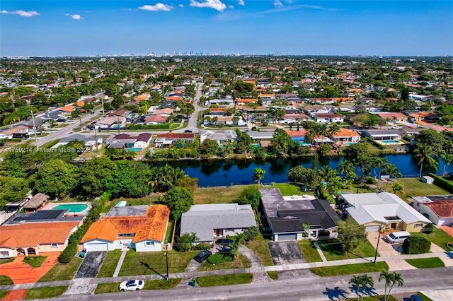 birds eye view of property with a residential view and a water view